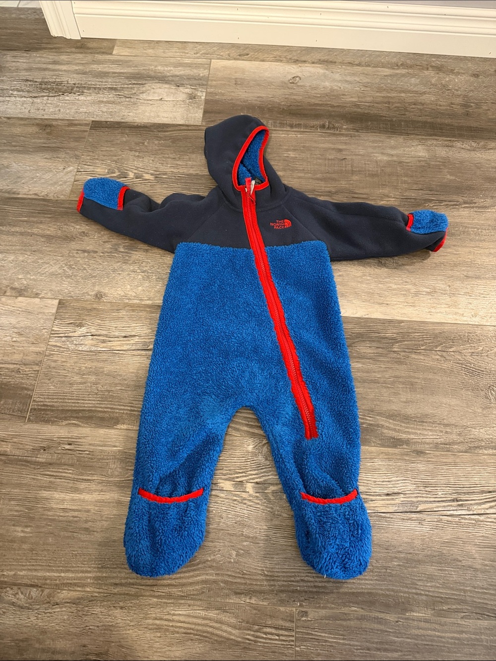 The North Face Blue & Navy Sherpa Footie with Red Trim - Kids